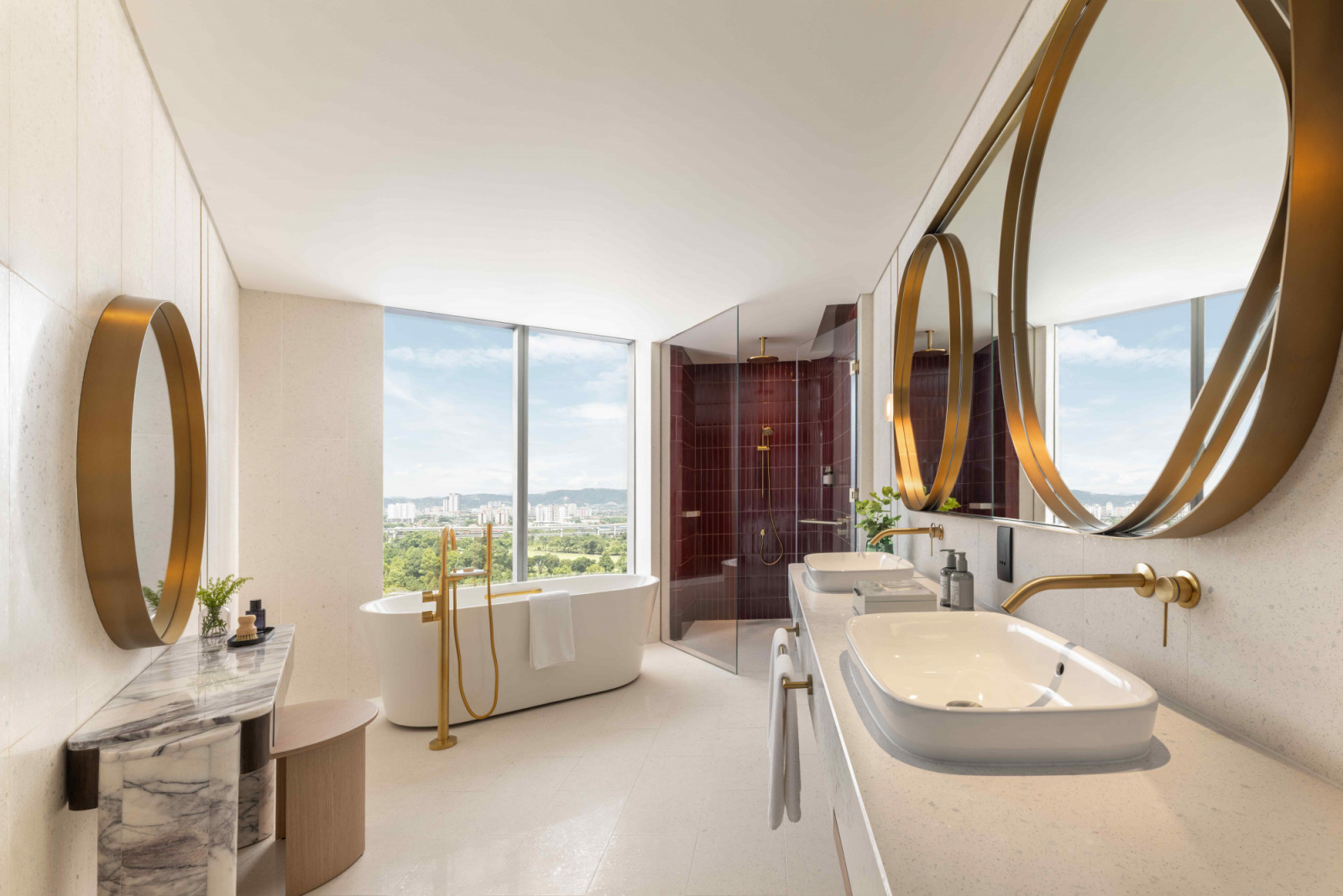 Bold-hued tiles, leaf-shaped mirrors and gilded bathroom fittings