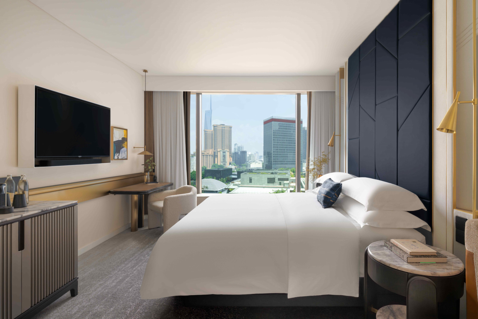 The Essential Room with framed views of the city