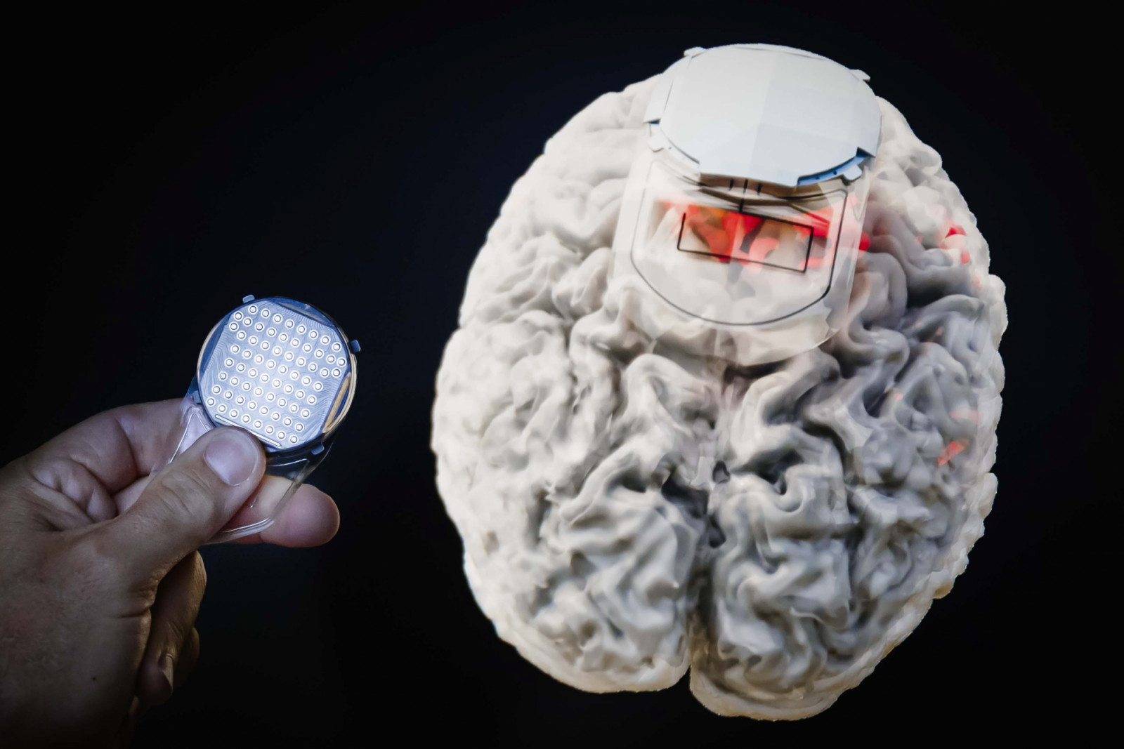 Rolex Awards Laureate Grégoire Courtine holding the implant, which is inserted into the brain. Courtine has now taken his work to the next level with one remarkable patient who he is treating for a complete spinal fracture  – a more severe injury than he has ever worked with before.