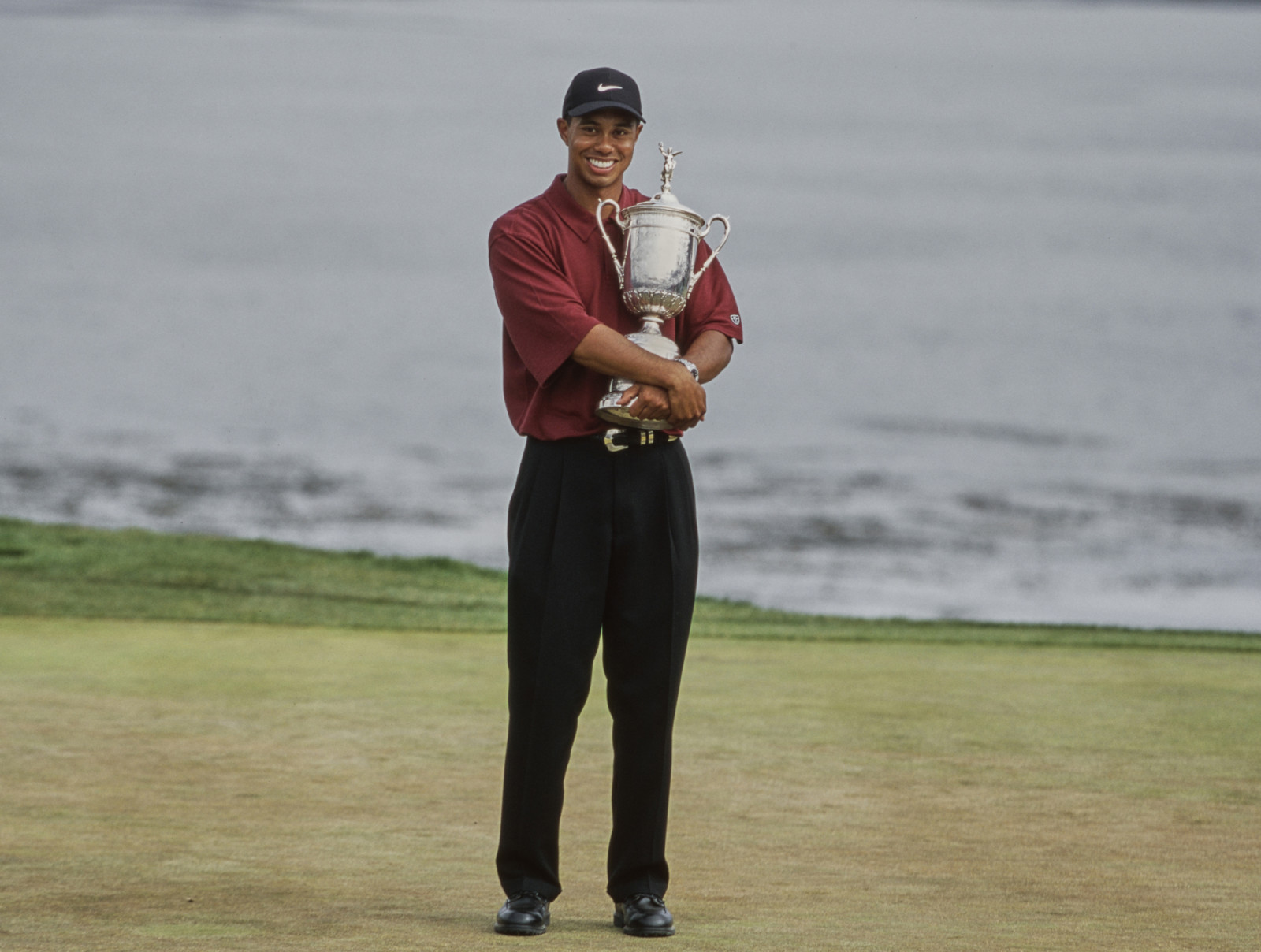 Tiger Woods from the United States holds the United States Golf Association Open Championship trophy after winning the 100th United States Open golf tournament on 18th June 2000 at the Pebble Beach Golf Links in Pebble Beach, Monterey, California, United States. (Photo by David Cannon/Allsport/Getty Images)