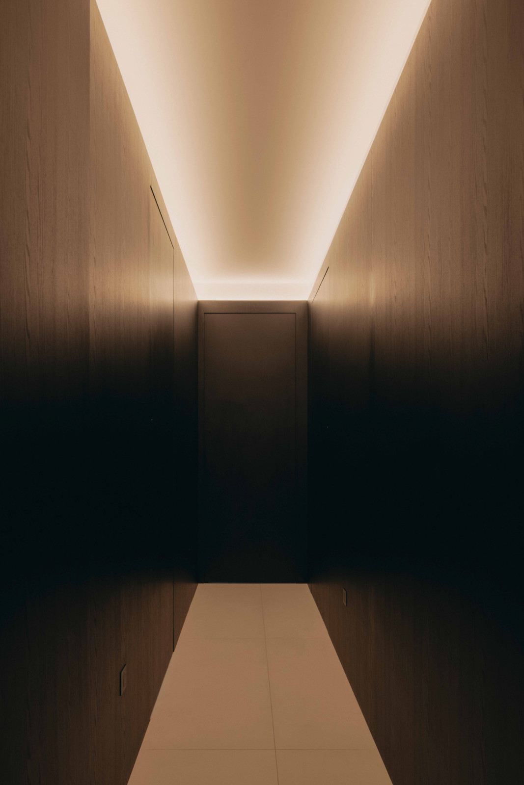 The corridor leading to the bedrooms is clean-lined and seamless