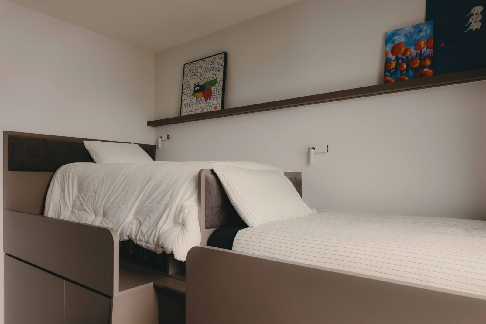 The boys’ custom beds evoke an adventurous spatial spirit
