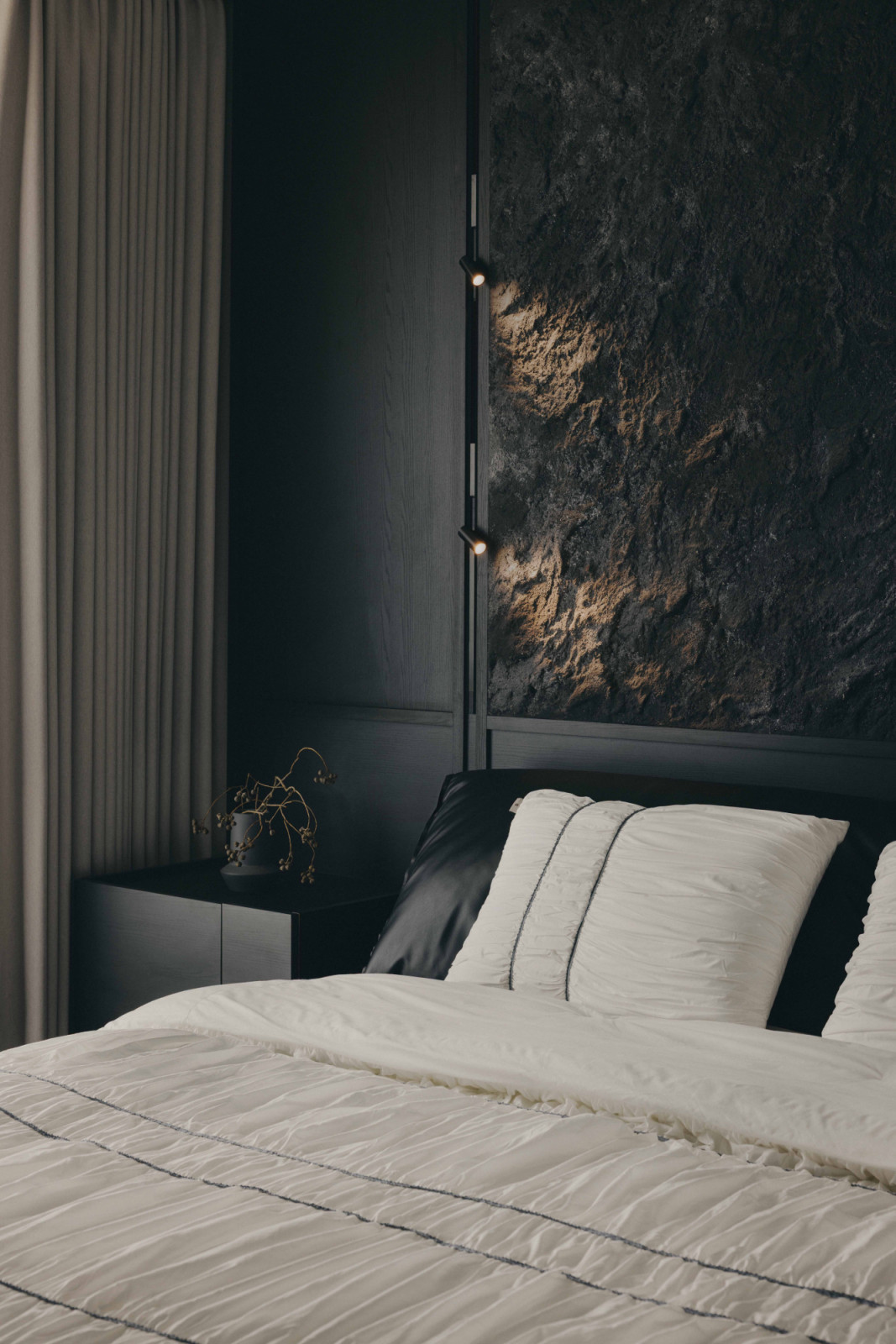 A monochromatic corner in the apartment’s master bedroom highlights its layered textures