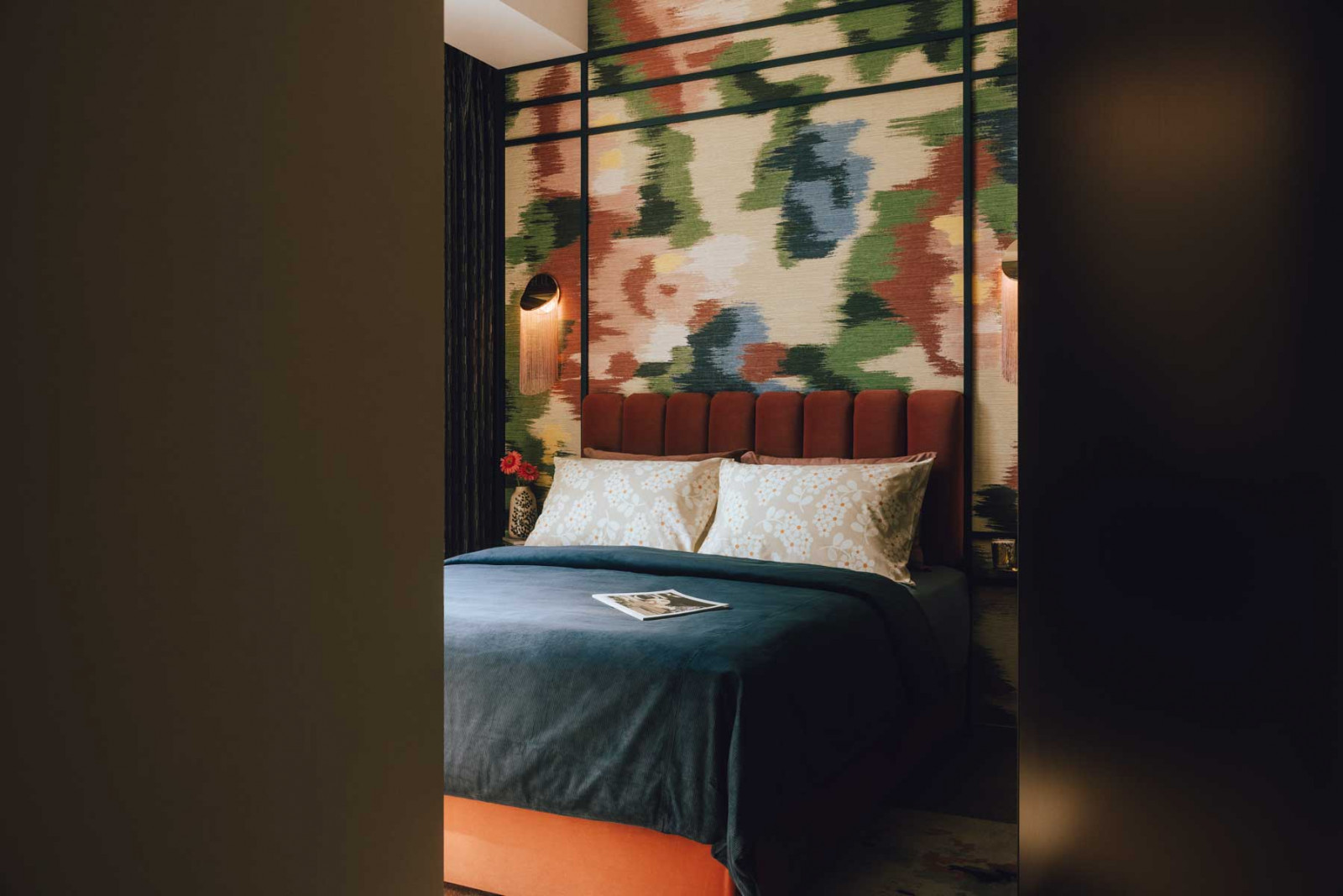 The master bedroom is furnished with Darmes Cé Petite wall lamps and the Curvature wall table from Ferm Living