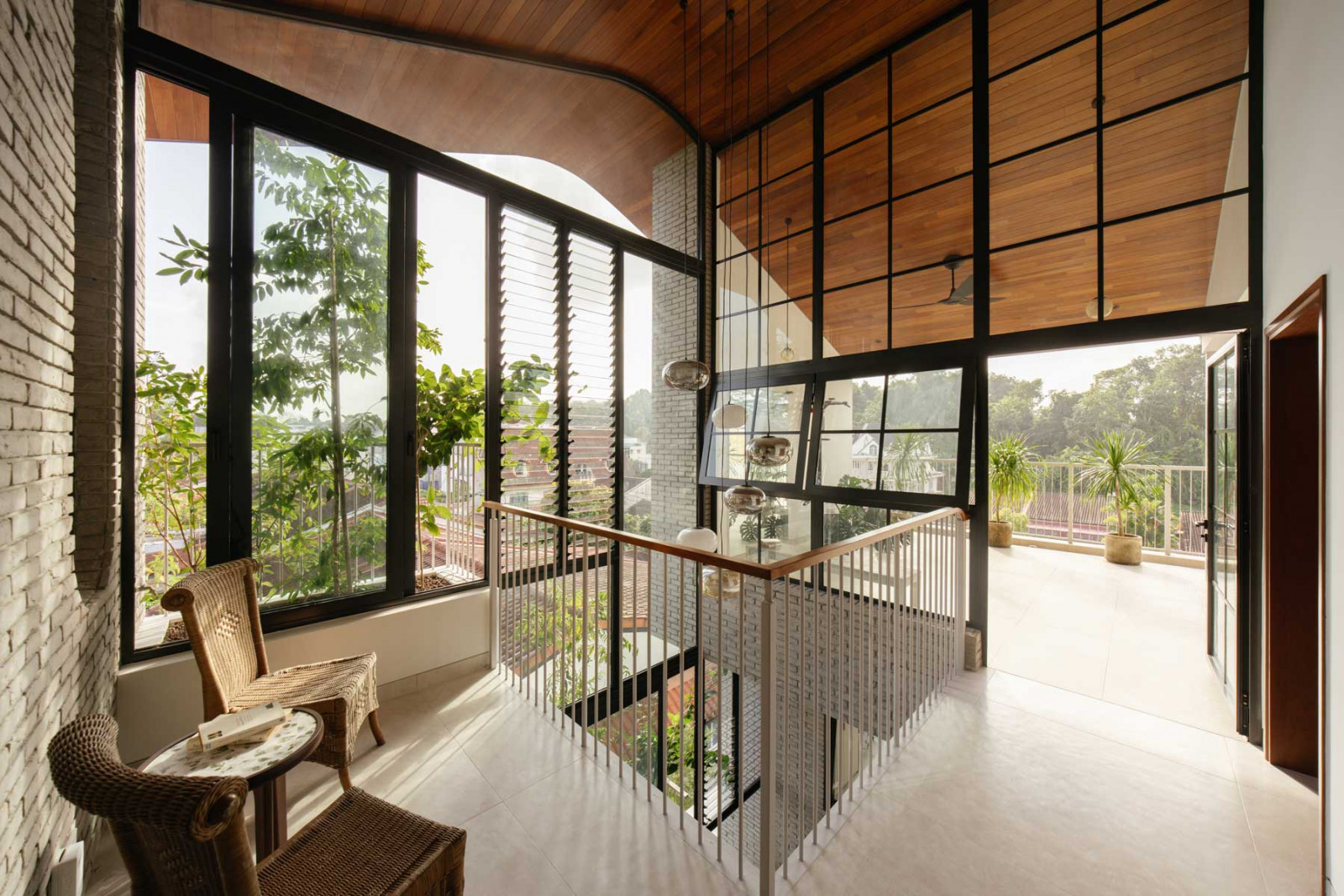 Unified flooring ensures continuity between the attic and outdoor terrace, visually expanding the interior