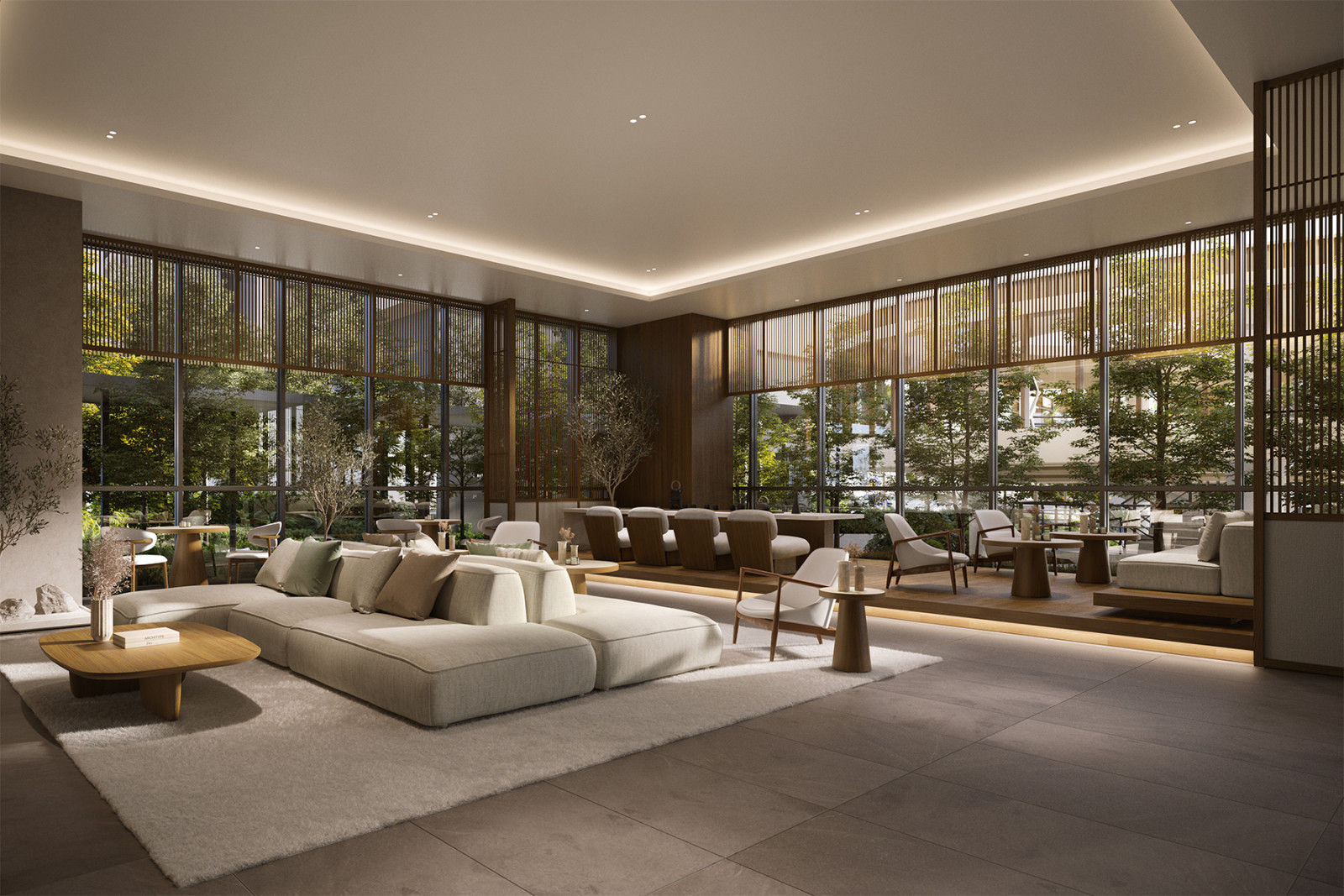 The Resident Lounge in earthy tones and framed by verdant landscaping