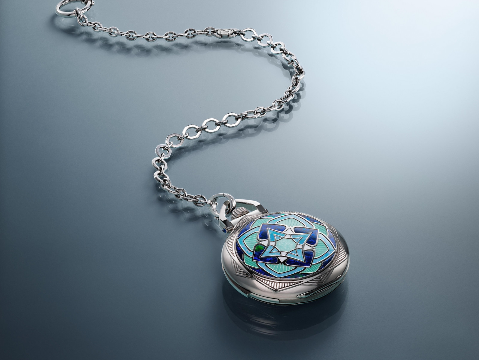 Parmigiani Fleurier celebrates the 75th birthday of its founder, Michel Parmigiani, with the La Ravenale Minute Repeater, which blends old world charm and modern technical prowess. With a white-gold case a]nd a deep blue dial, this Lépine pocket watch takes cues from nature itself.