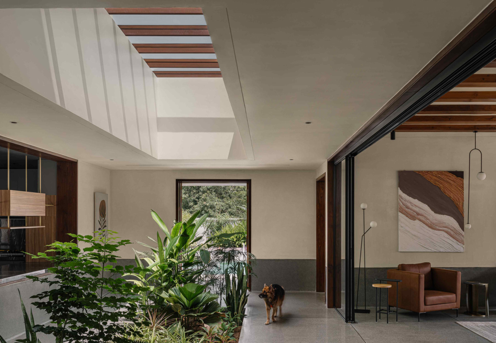 The linear courtyard leads to the pool deck at the rear