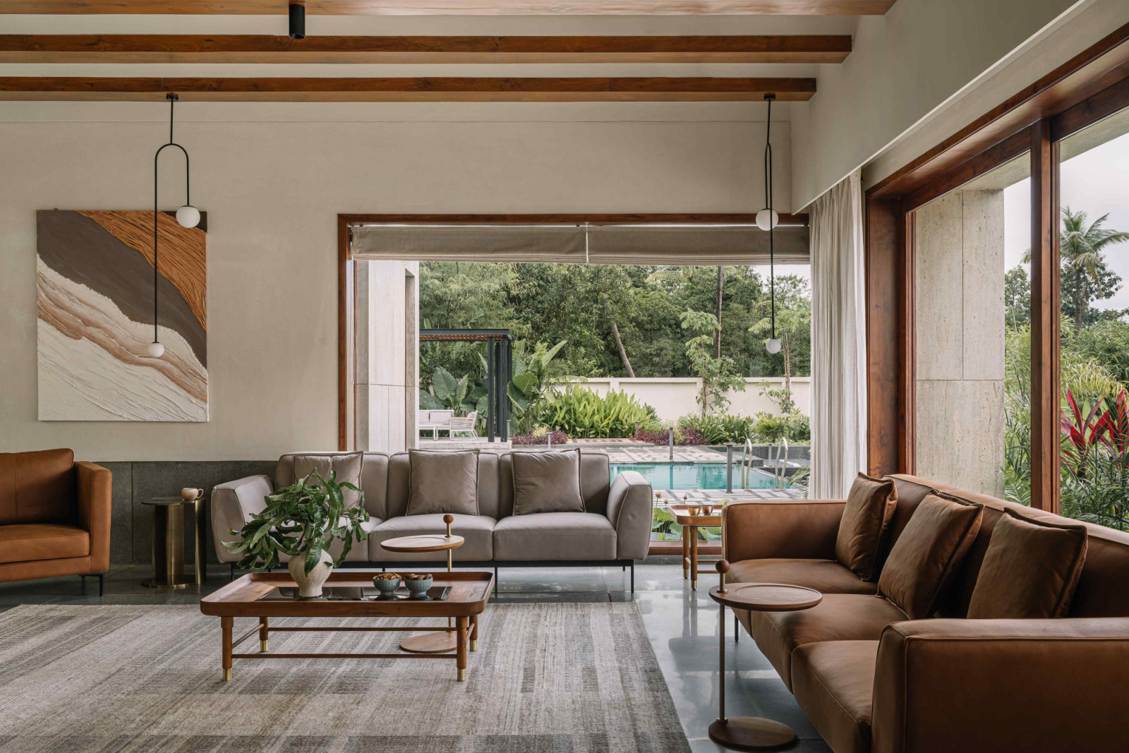 The living area with picture views of the pool and surrounding garden