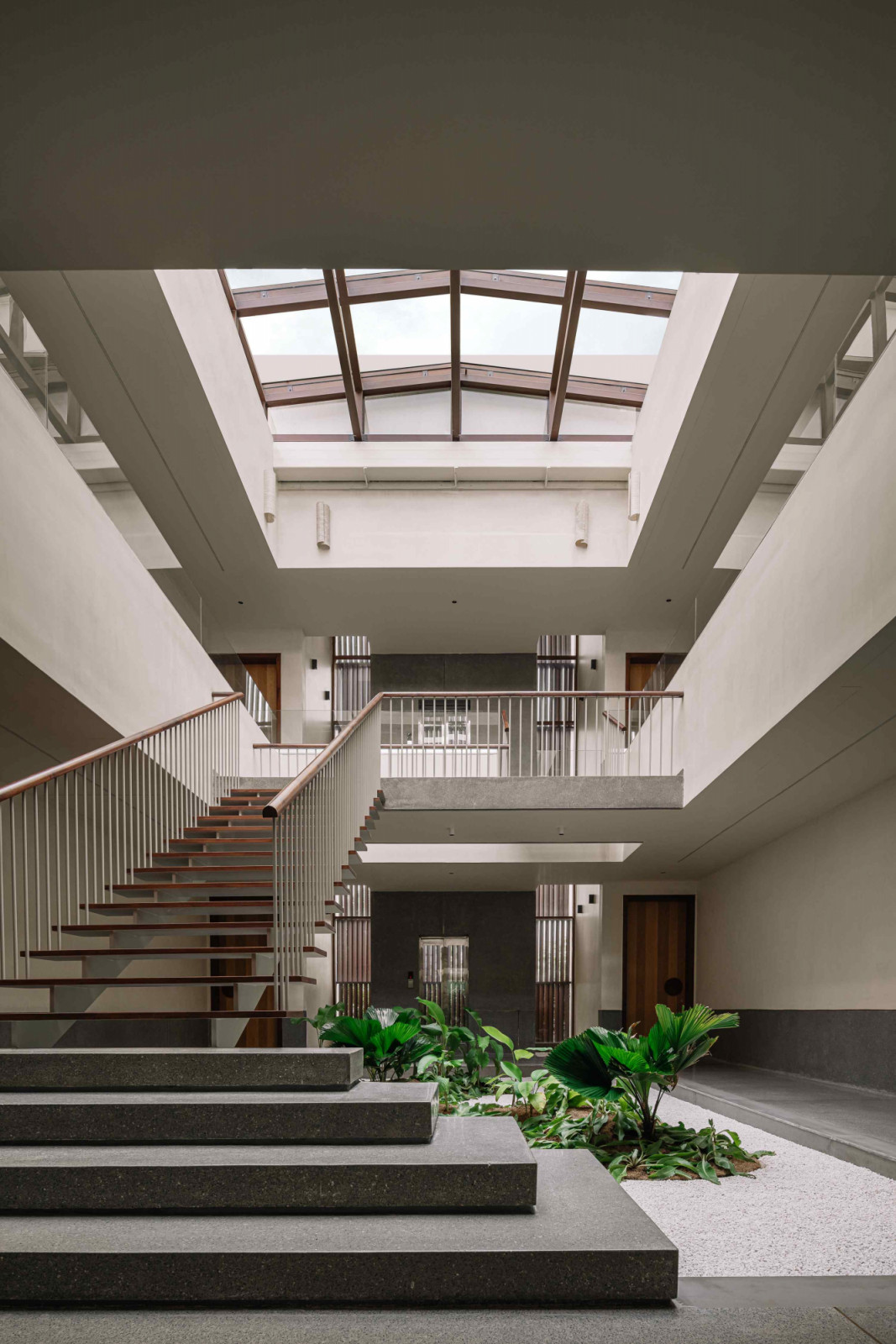 The anchoring central staircase flooded with natural light