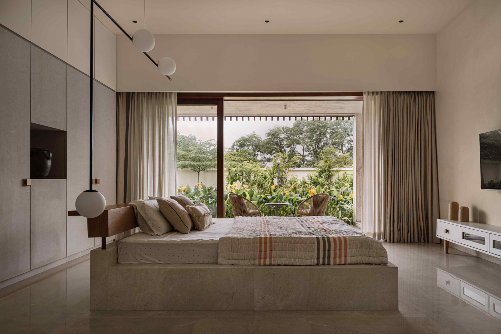 The daughter’s bedroom anchored by a custom-made marble island bed