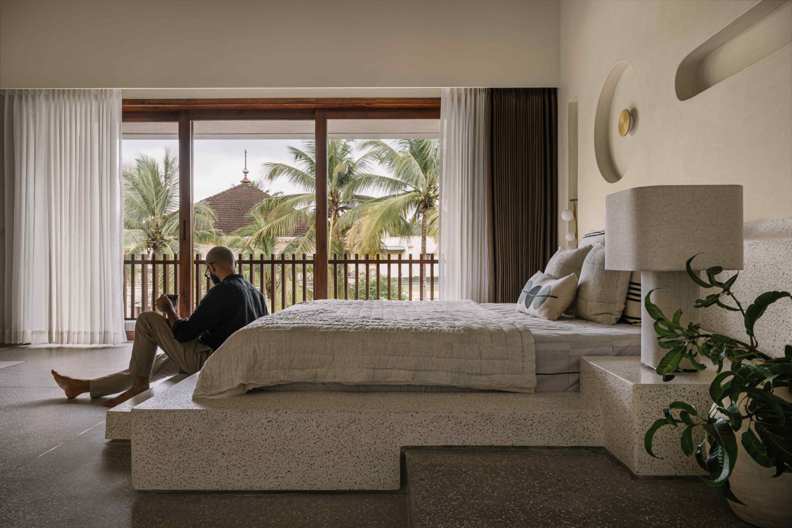 One of the guest rooms with an elevated bed platform made from cast-in-situ terrazzo