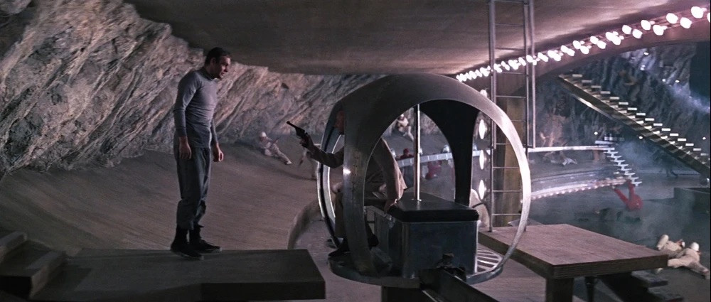 Interior detail of Adam’s Fort Knox vault showing the circular skylight and laser apparatus. The stark geometry and dramatic lighting established the visual language for 1960s space-age interiors