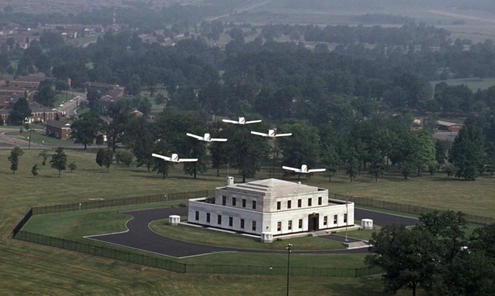 Ken Adam’s Fort Knox exterior from Goldfinger (1964). The 40-foot-high vault interior was built entirely at Pinewood Studios using geometric forms and substantial materials rather than typical wood-and-paper backdrops