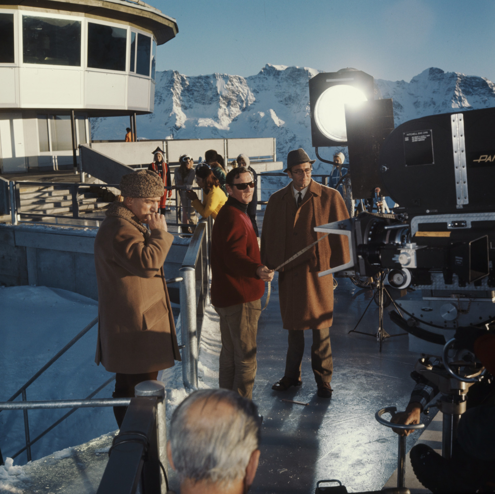 Behind-the-scenes filming at Piz Gloria for On Her Majesty’s Secret Service (1969). The Bond production helped finance the completion of architect Konrad Wolf’s rotating restaurant in exchange for filming rights, and has operated continuously since 1969