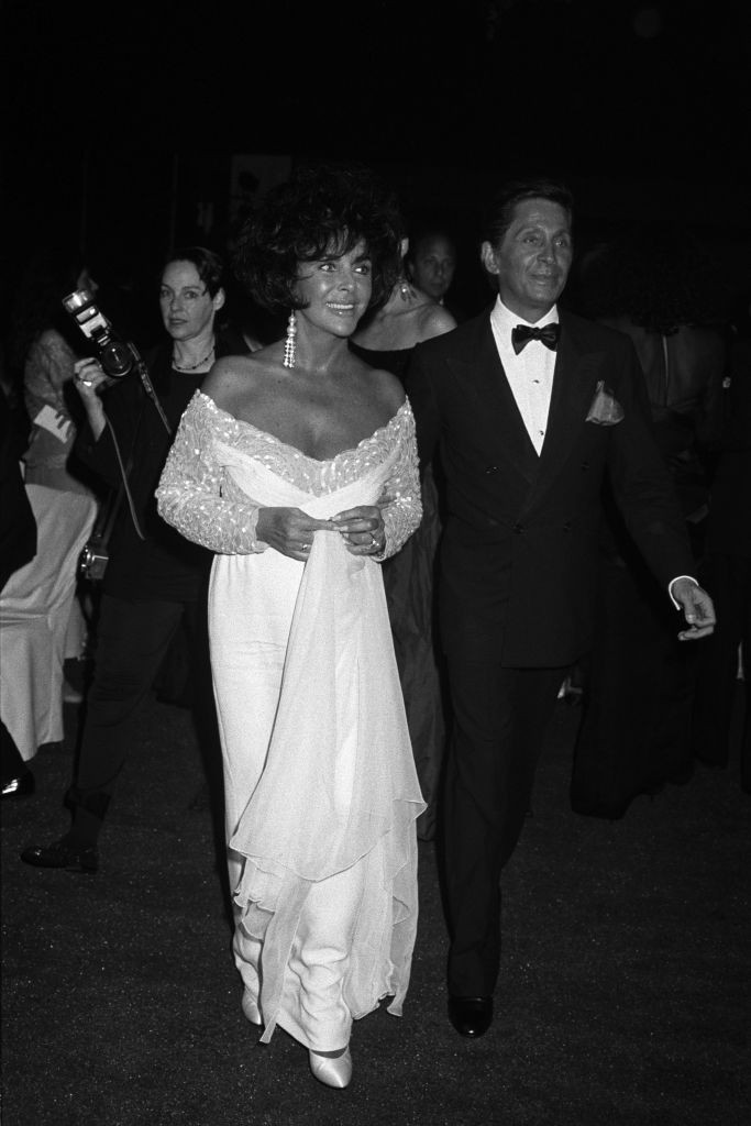 Actress Elizabeth Taylor (L) and fashion designer Valentino Garavani attend a Valentino gala in 1991. (Photo by Fairchild Archive/Penske Media via Getty Images)