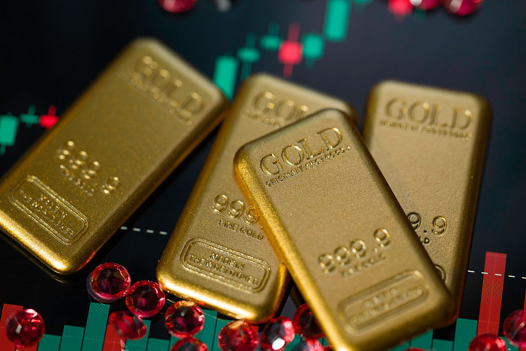 Gold bars are displayed in a photo illustration, reflecting recent movements in gold prices driven by inflation concerns and central bank policy outlooks in Brussels, Belgium, on December 23, 2025. (Photo by Jonathan Raa/NurPhoto via Getty Images)