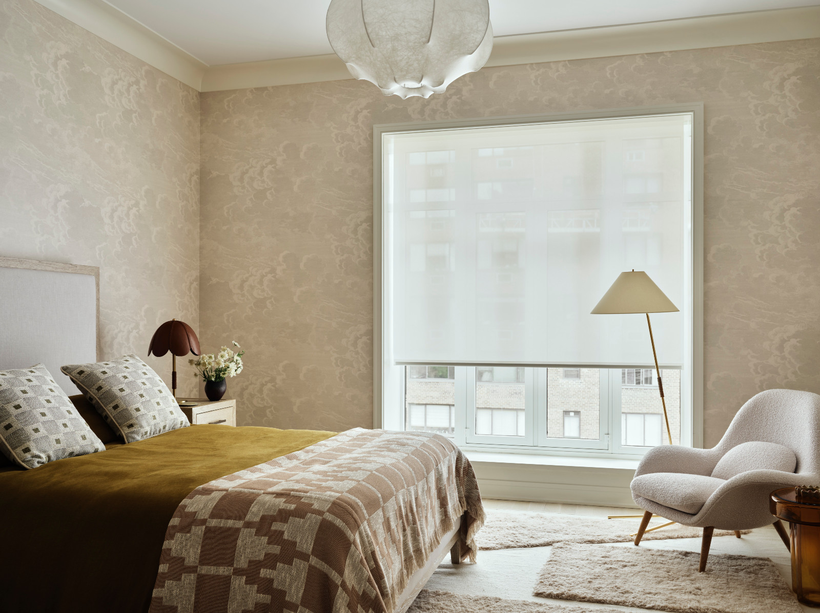 The primary bedroom in a New York apartment, designed by Lucy Harris