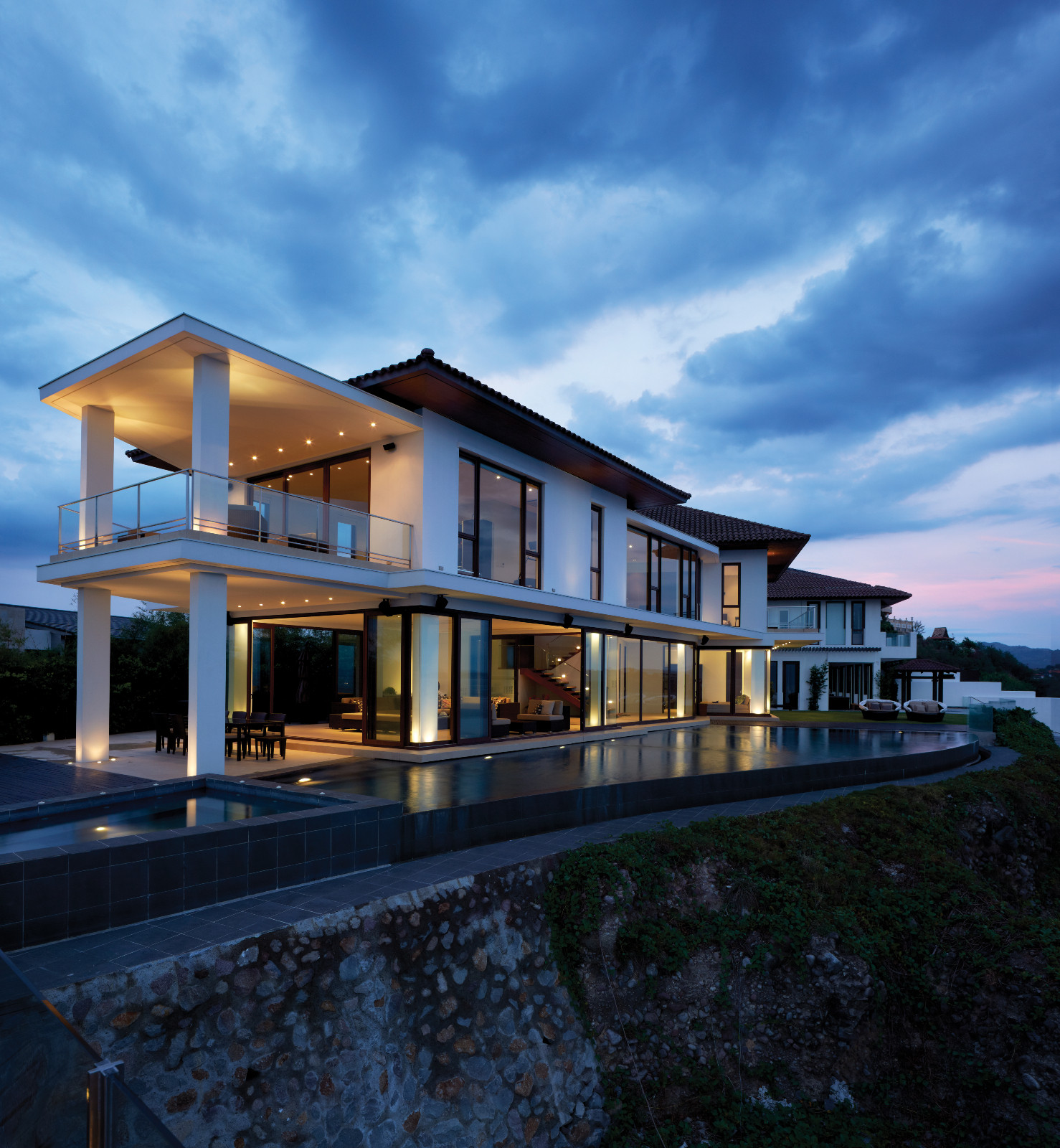 An abstraction of a longhouse on stilts, connected by sleek glass bridgeways