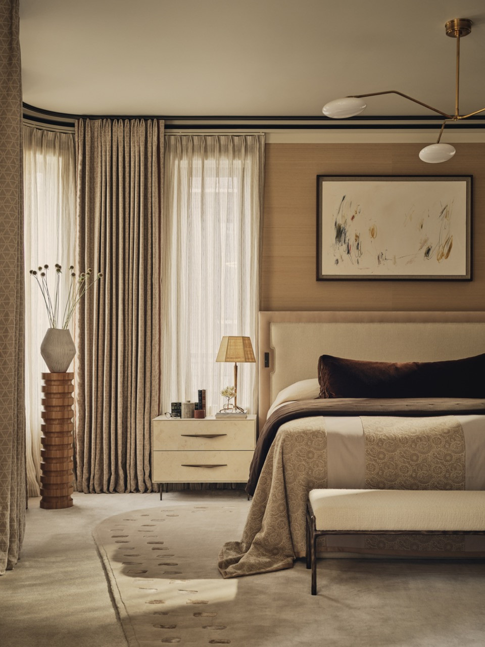 The principal bedroom, which Bense describes as one of his favourite spaces, fully wallpapered with soft layered textiles.