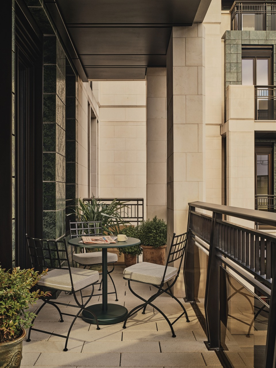 The 108-square-foot terrace features a Neptune outdoor armchair and Pierre Frey-upholstered dining chairs