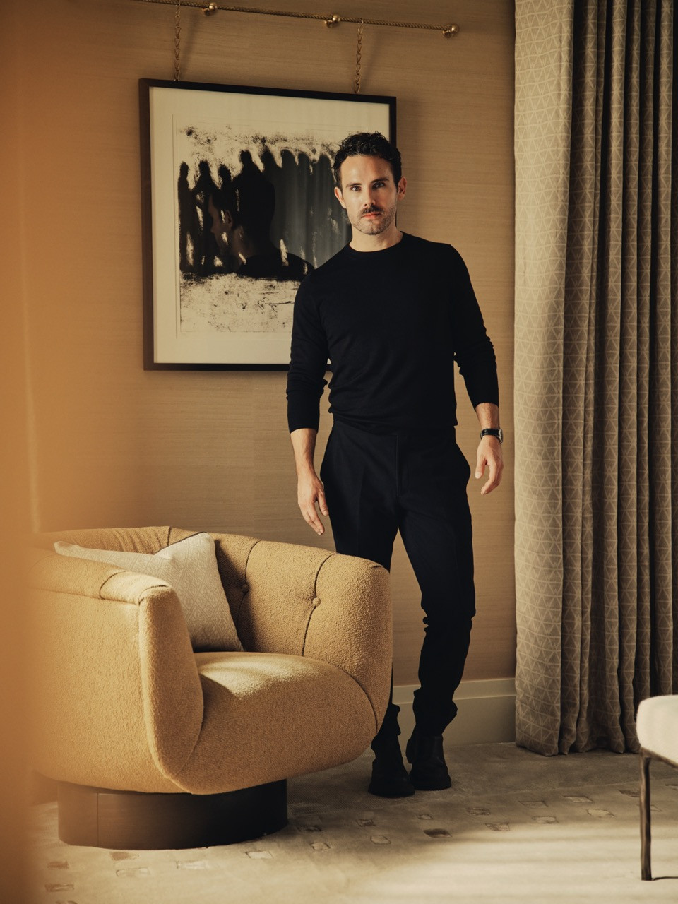 Christian Bense in the sitting area, where soft pinks, powder blues and creams define the main living spaces