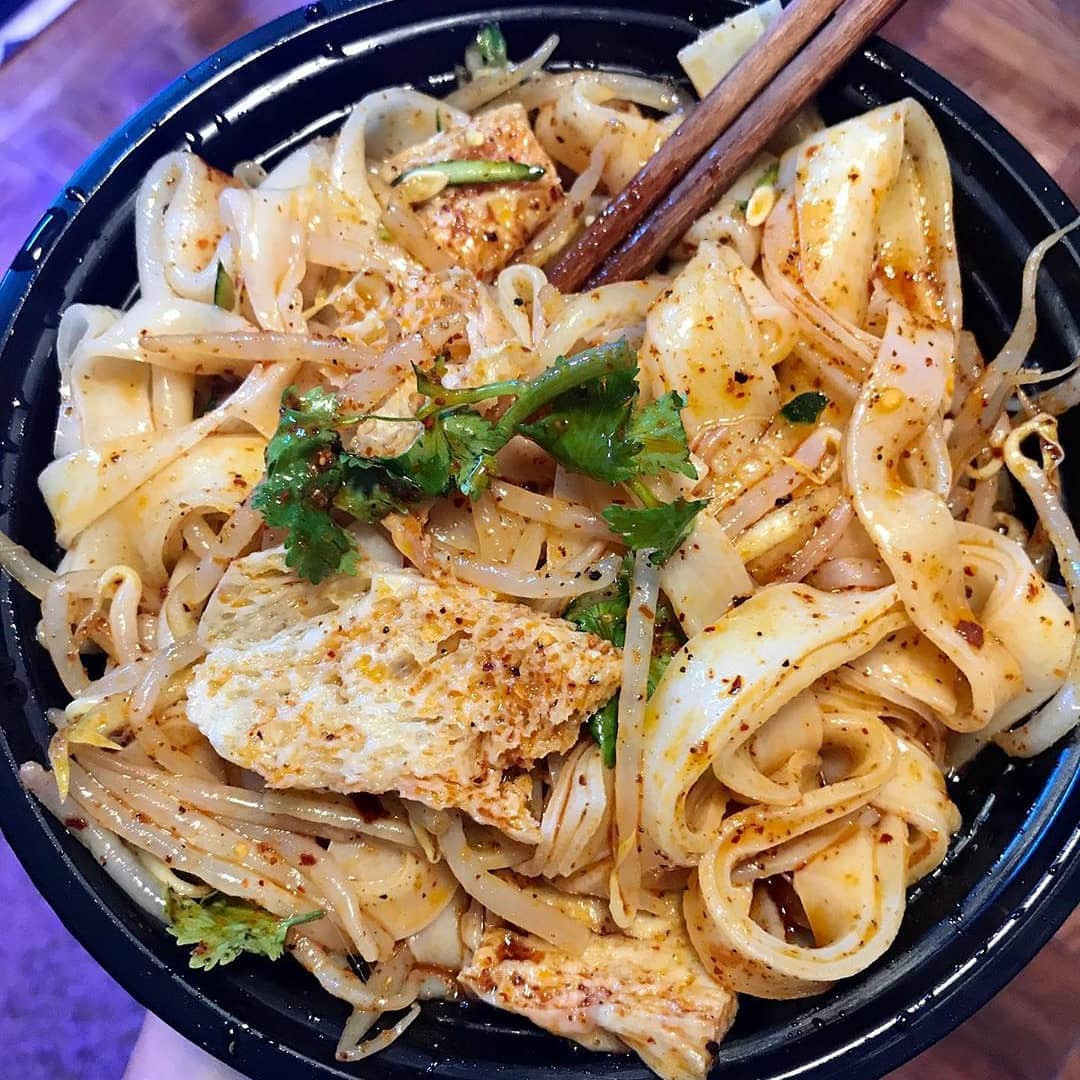 Liangpi combines soft, slippery wheat or rice noodles with tangy, spicy dressing, a popular cooling street-food dish from northern China (Photo: Xian Foods/Instagram)