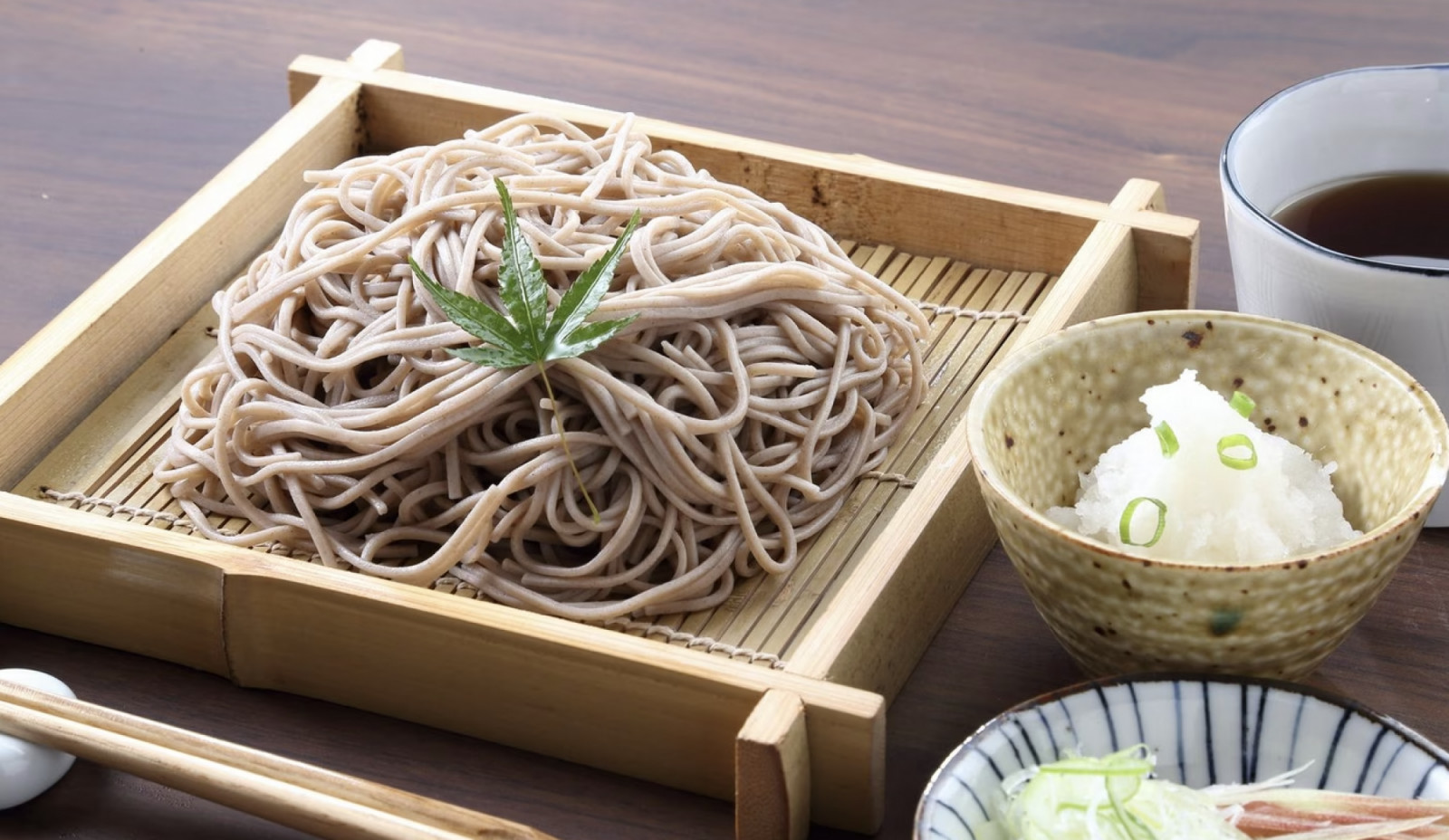 Zaru soba presents buckwheat noodles on a bamboo tray with a clean dipping sauce, exemplifying minimalist Japanese elegance (Photo: Japan Centre)