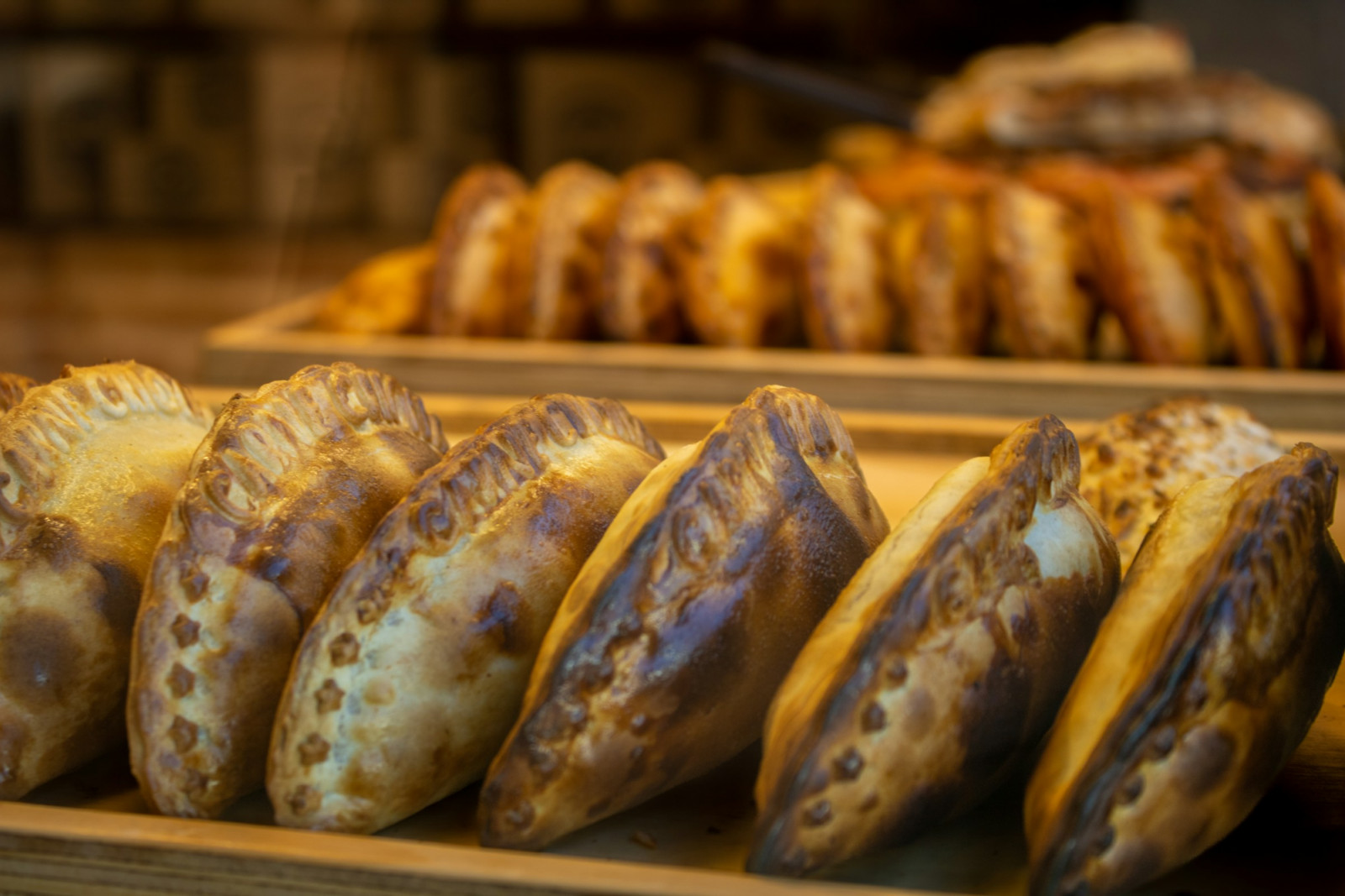 Empanadas are handheld parcels packed with regional fillings and baked or fried to order (Photo: Lucas Oriogun/Unsplash)