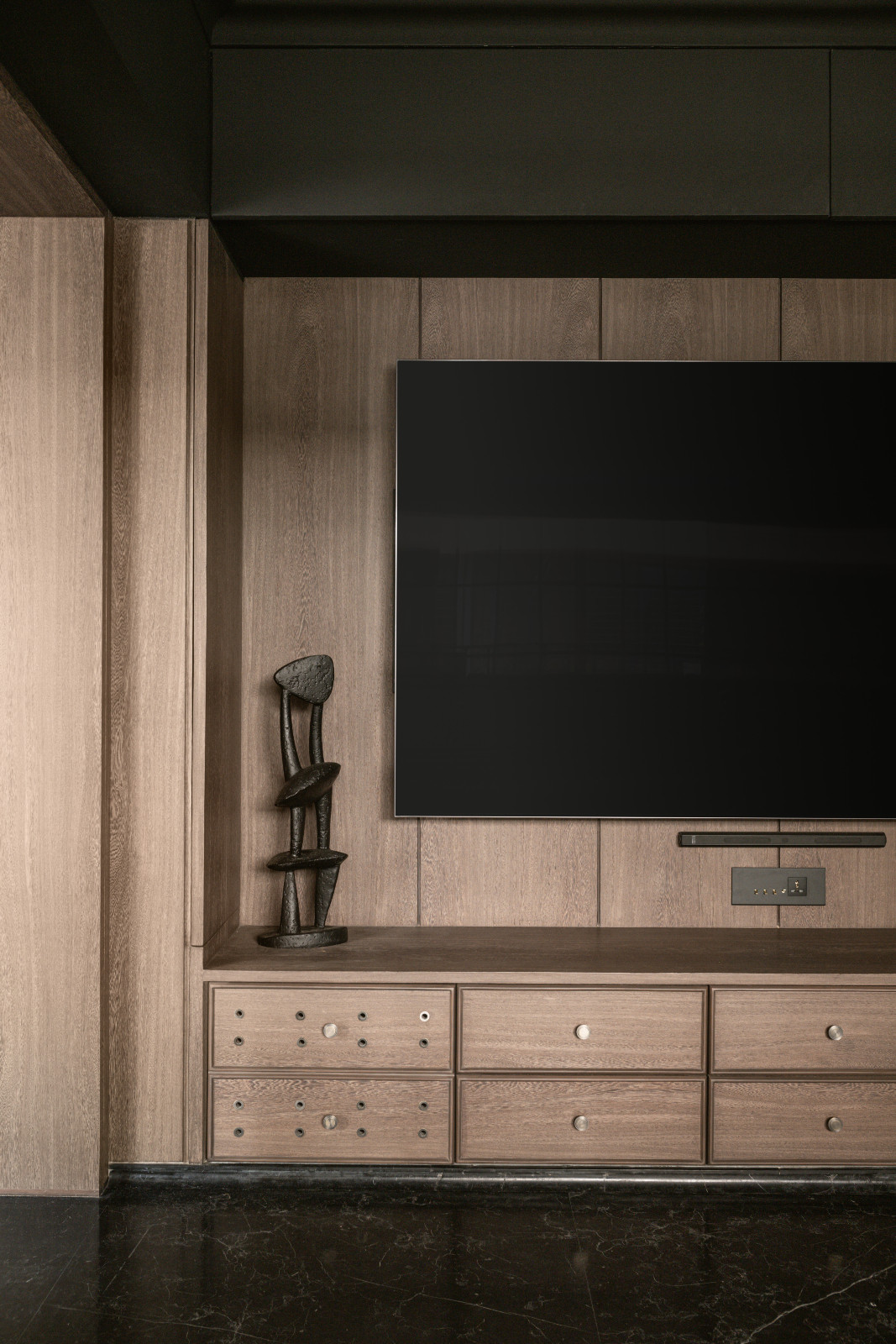 The media room in a neoclassical family home designed by Palindrome Space in Mumbai, India