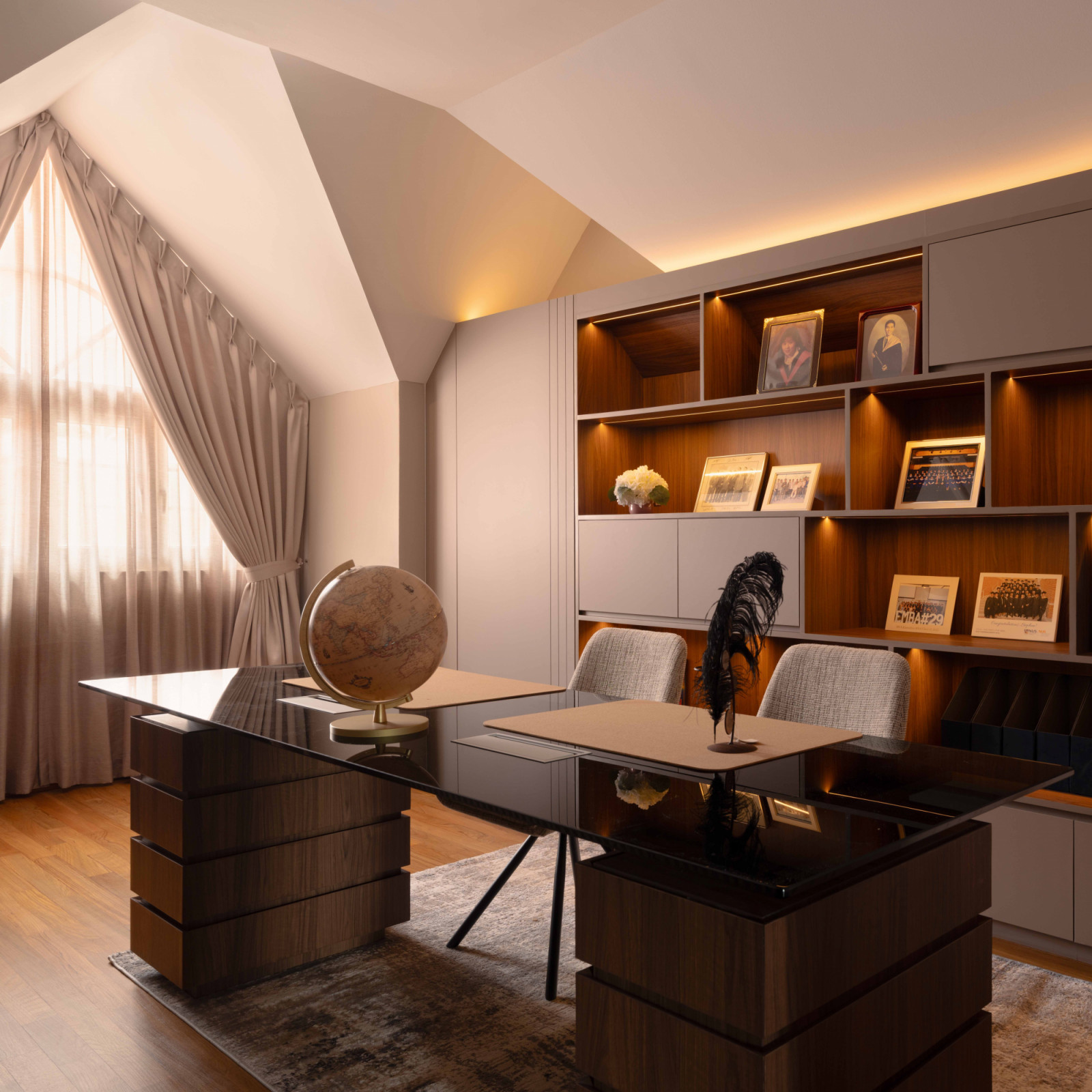 The shared study area is a handsome yet functional zone defined by mahogany tones