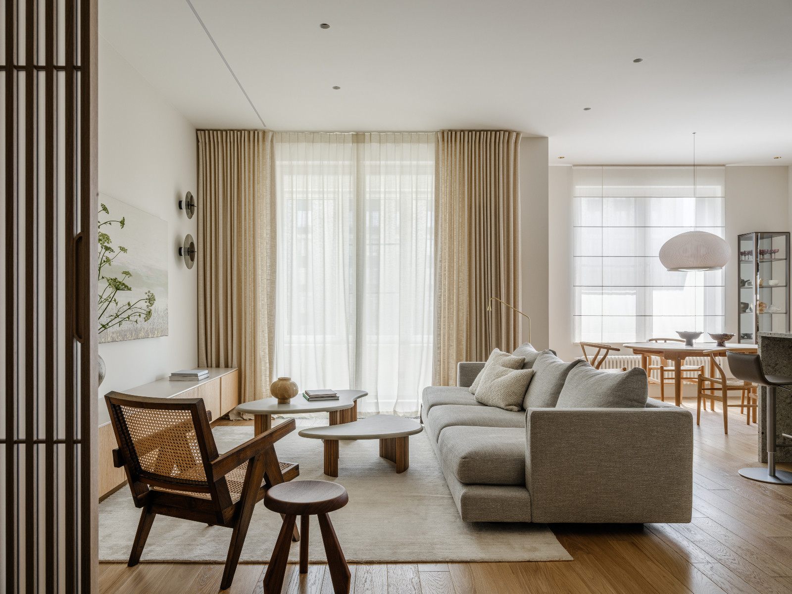 An open-plan living room, kitchen and dining area in a Korean-inspired home in Moscow, Russia by Inga Kordya