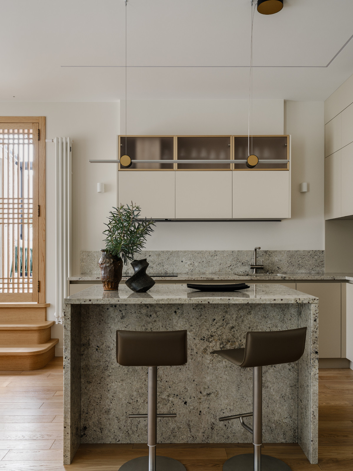 The kitchen area in a Korean-inspired home in Moscow, Russia by Inga Kordya