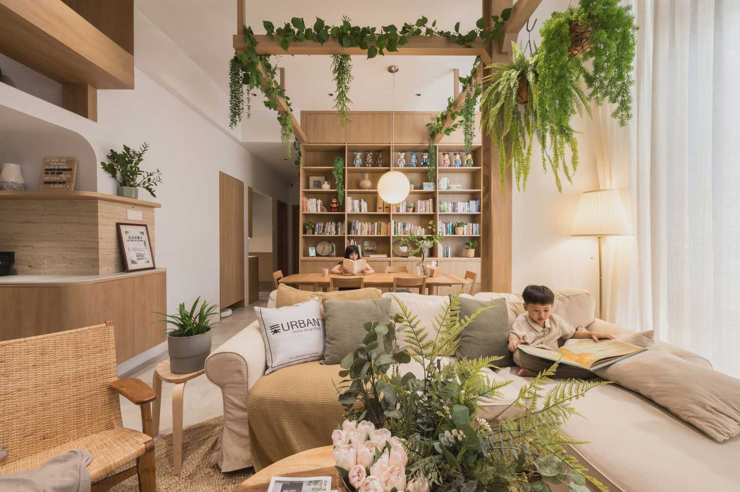 This delightfully breezy zone features a large customised bookshelf, which is the centrepiece of the home