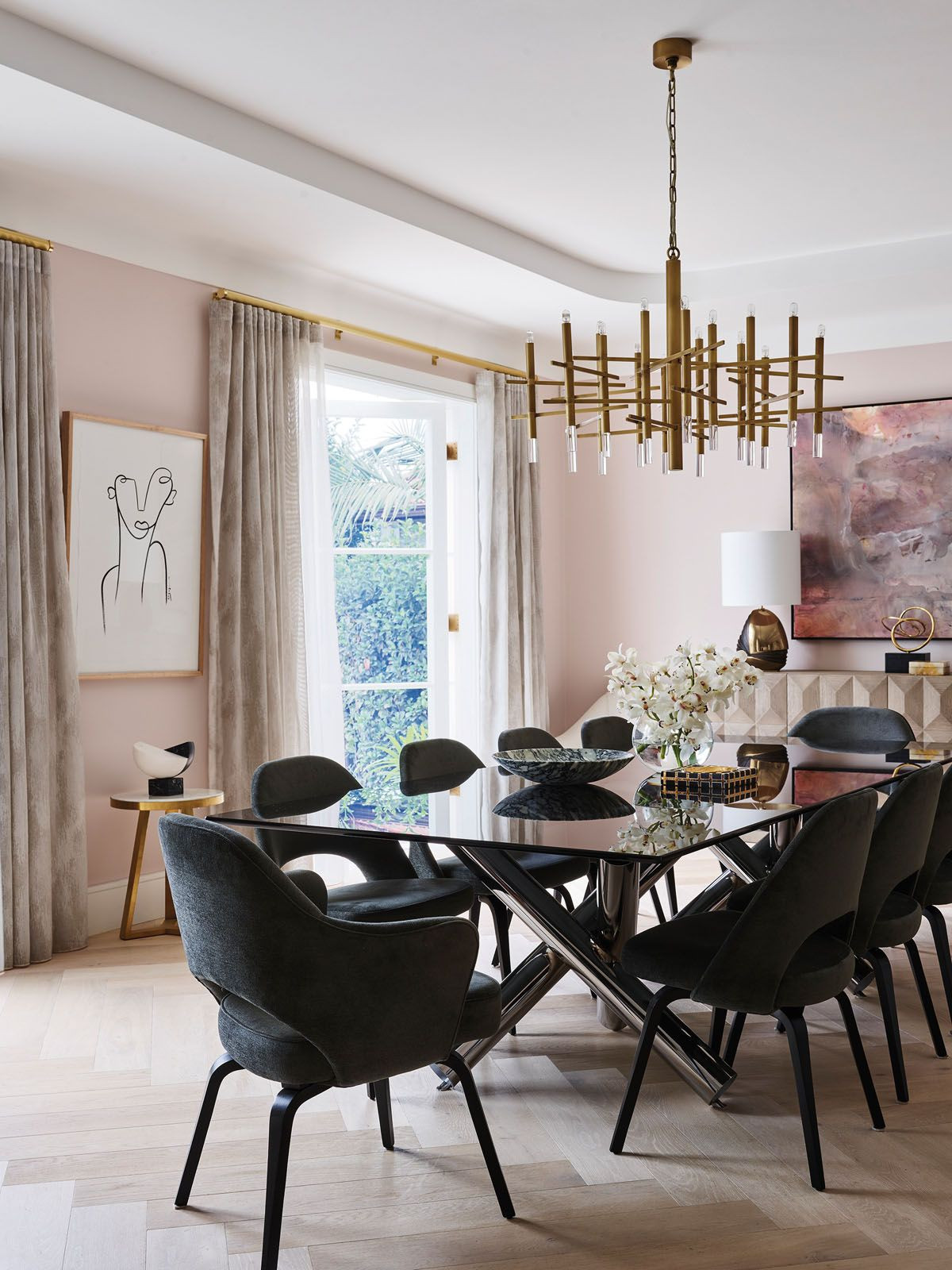 A custom-made Carrara marble fireplace holds court in the living room