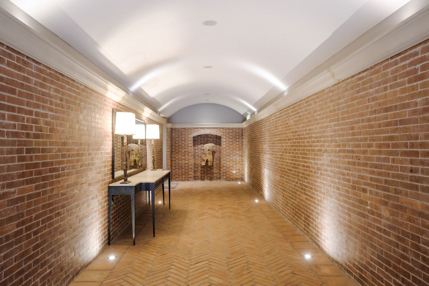 Brick walls and floor tiles lend warmth to the space