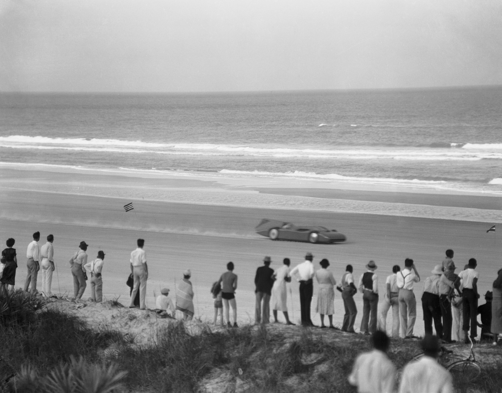 08 Mar 1935, Daytona Beach, Florida, USA --- Original caption: How a Car Looks Going 281 Miles Per Hour. Daytona Beach, Florida: This is how Sir Malcolm Campbell's car "Bluebird" looked when he hit 281 miles per hour on one leg of his two record breaking runs here. On the first dash Sir Malcolm had made 272 miles per hour. --- Image by © Bettmann/CORBIS