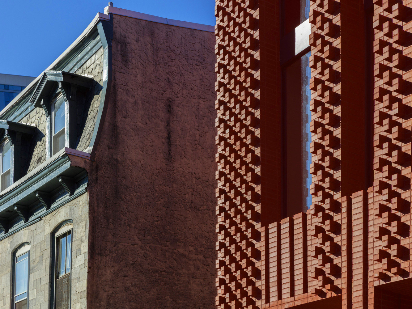 Locally sourced red brick recesses and protrudes, catching and reflecting daylight (Photo: Instagram / @stanley_saitowitz)