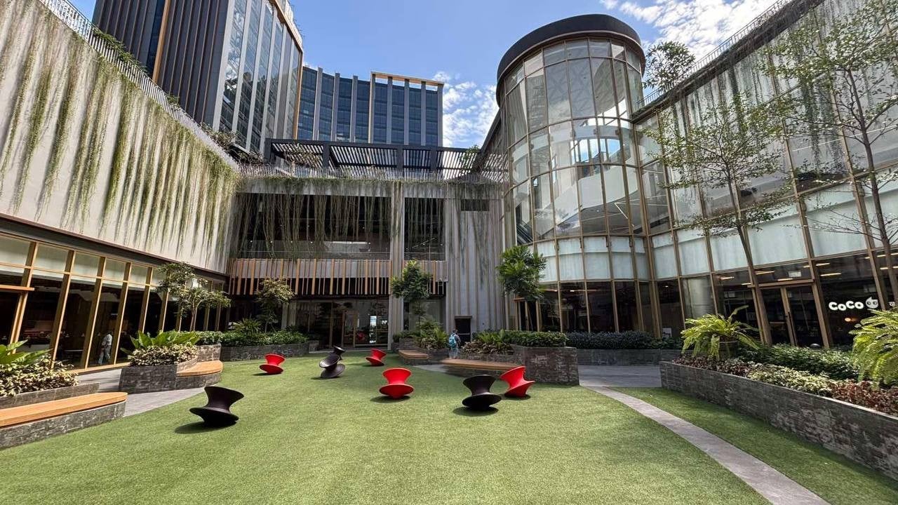 The Serenity Approach: A lush, open-air sanctuary where vibrant greenery and modern architecture create a perfect pocket of calm.