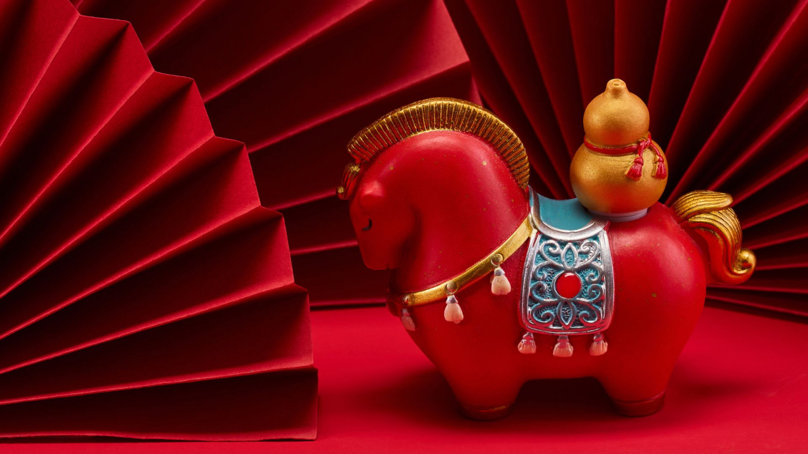 From limited trainers and fragrance bottles to heritage leather goods and high jewellery, these Lunar New Year releases trace how brands interpret movement, craft and symbolism through the horse (Photo: Canva)