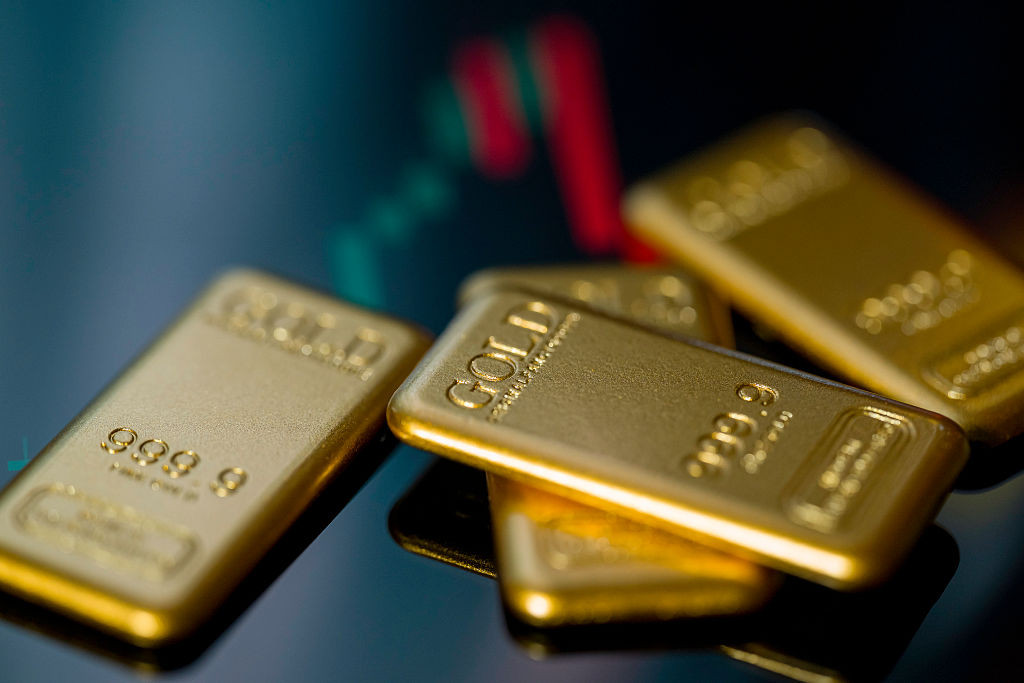 Gold bars are displayed in a photo illustration, reflecting recent movements in gold prices driven by inflation concerns and central bank policy outlooks in Brussels, Belgium, on December 23, 2025. (Photo by Jonathan Raa/NurPhoto via Getty Images)