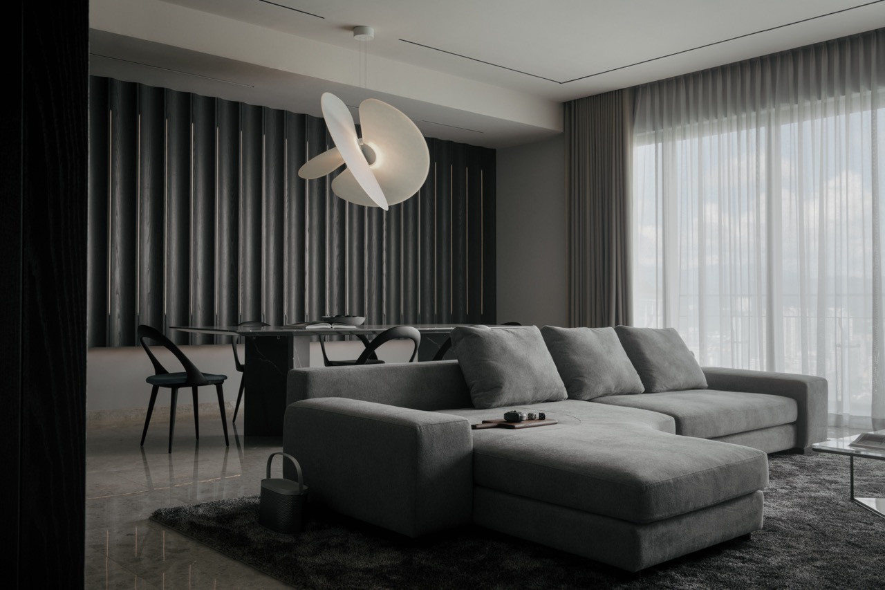 The living room features a Frog sofa by Living Divani, with fluted dark timber panels, and the Levante pendant by Lucepl visible beyond