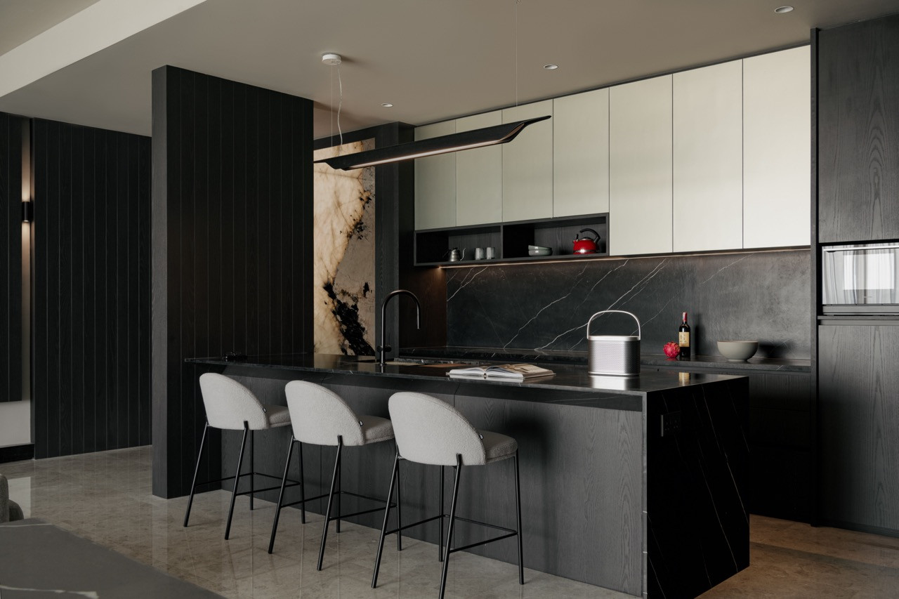 Black Marquina marble pairs with brushed Chardonnay gold cabinetry and Troag pendant by Foscarini