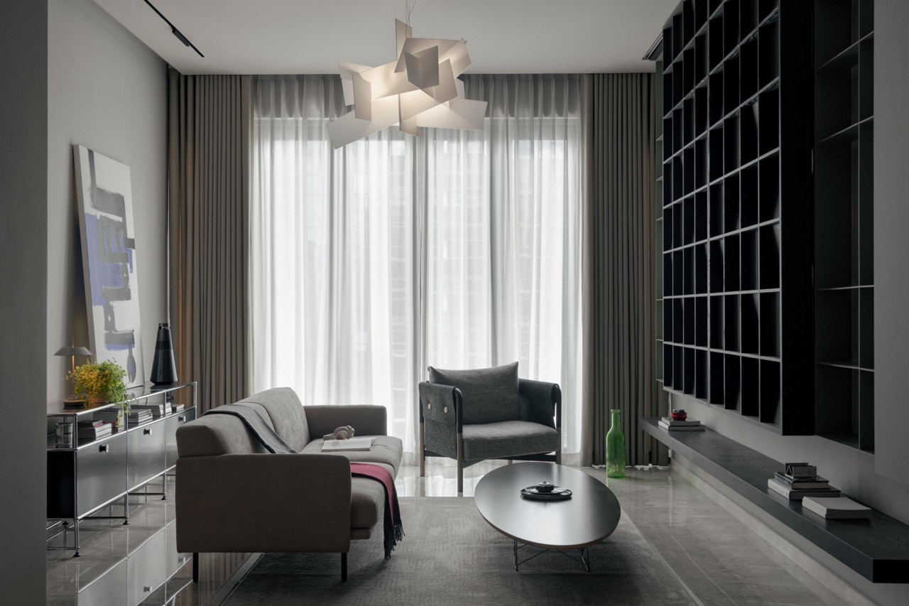 Fluted dark timber panels with concealed LED strips create adjustable ambient lighting