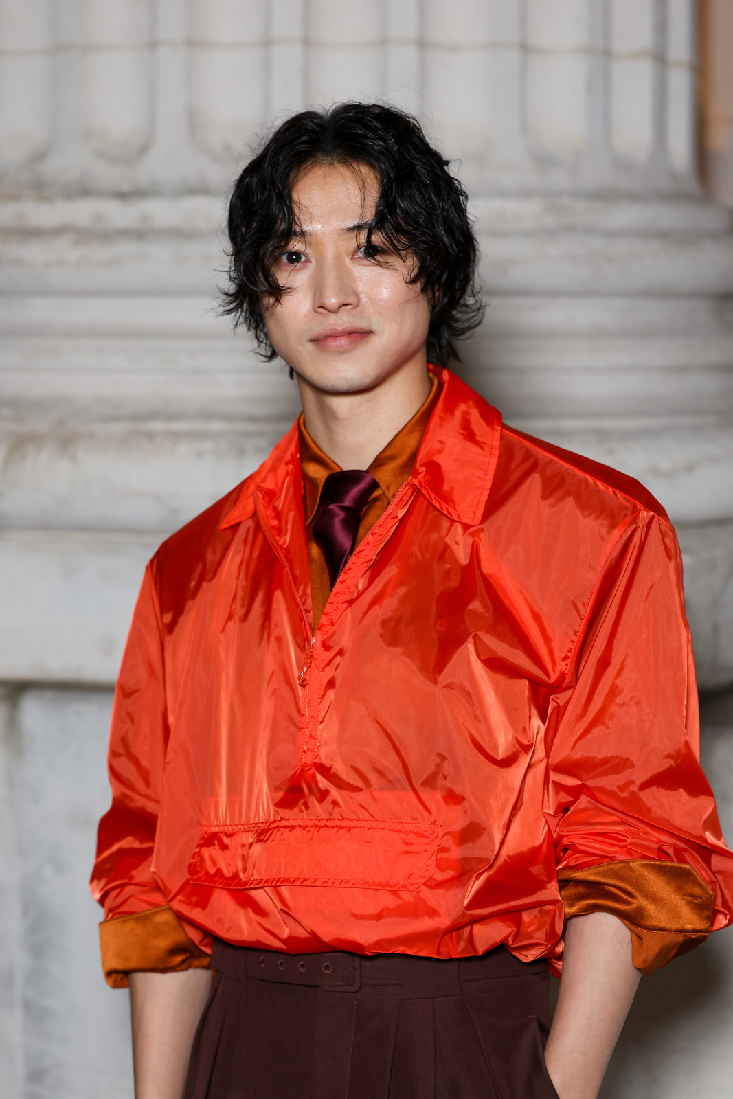 Kento Yamazaki wears Saint Laurent in sunset hues (Photo by Pierre Suu/Getty Images)