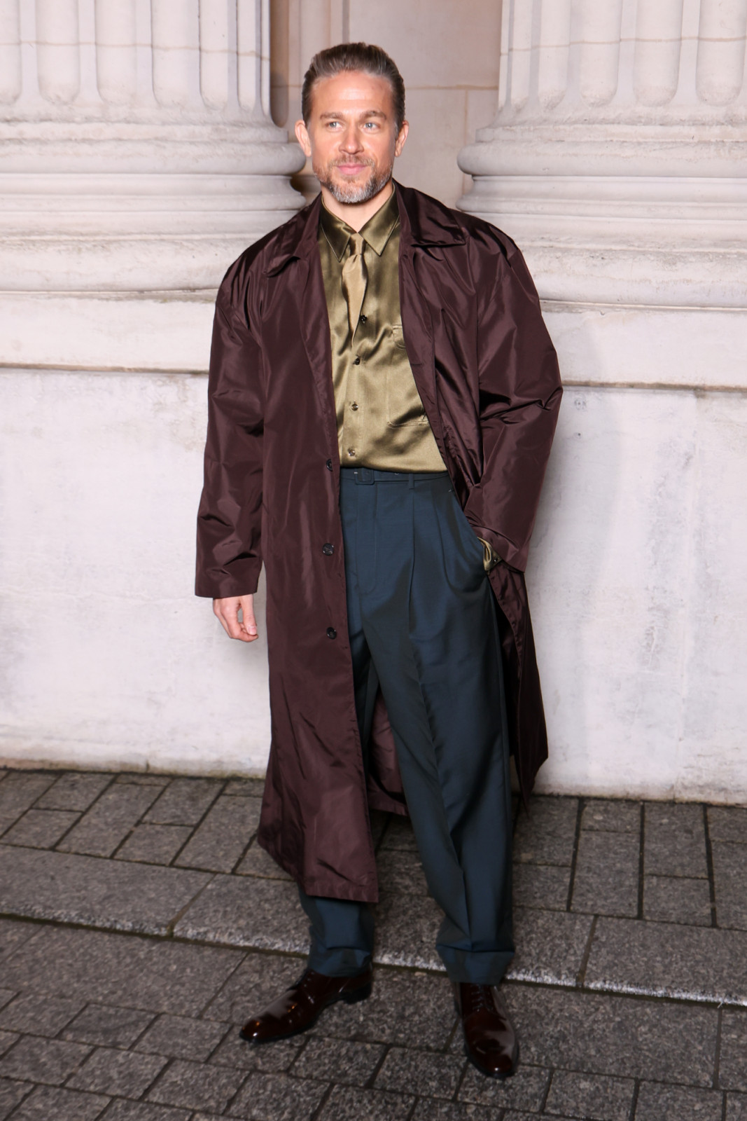 Charli Hunnam layers silky textures at Saint Laurent (Photo by Stephane Cardinale - Corbis/Corbis via Getty Images)