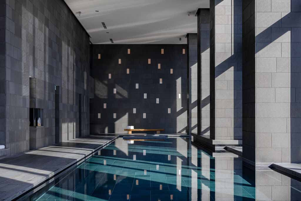 By day, the spa pool at Aman Tokyo is washed in natural light, its restrained palette and long horizon line heightening the sense of stillness above the city
