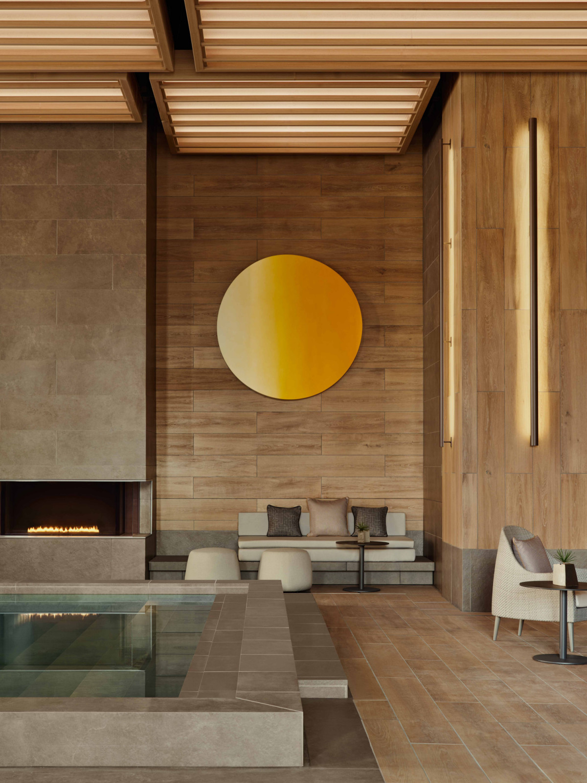 The heated lounge pool offers a quieter counterpoint to the lap pool, with integrated seating and warm materials