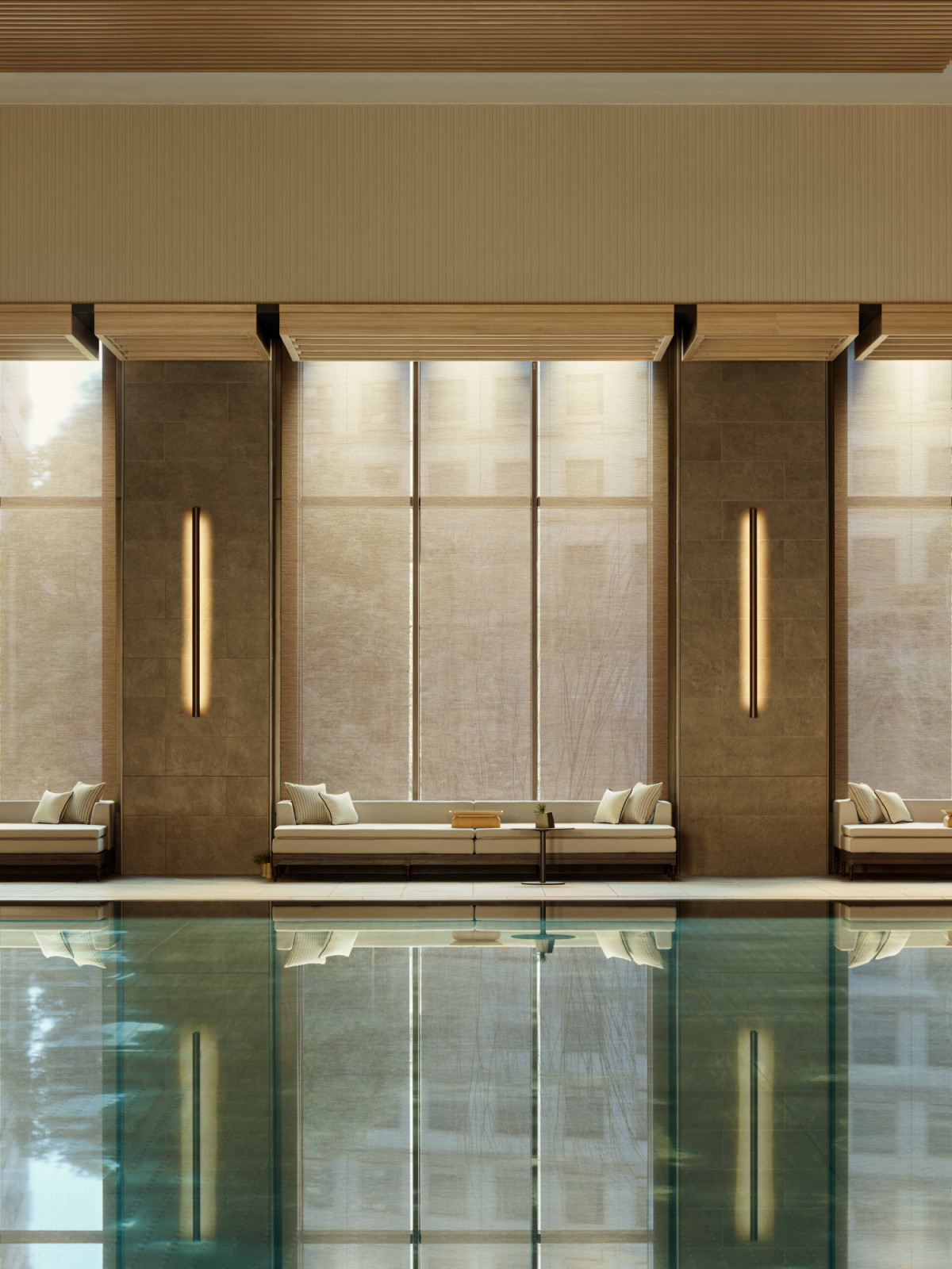 Framed by soft light and panoramic views, the poolside loungers at Janu Tokyo offer a quiet extension of the water experience