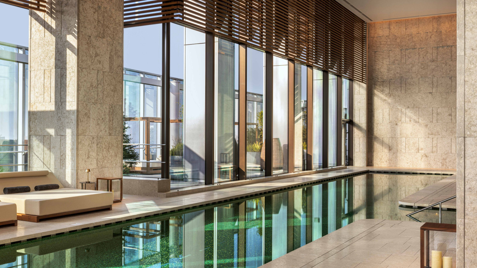 Wrapped in green mosaic tiles, the swimming pool at Bulgari Hotel Tokyo evokes the depth and brilliance of an emerald, set against sweeping skyline views from the 40th storey